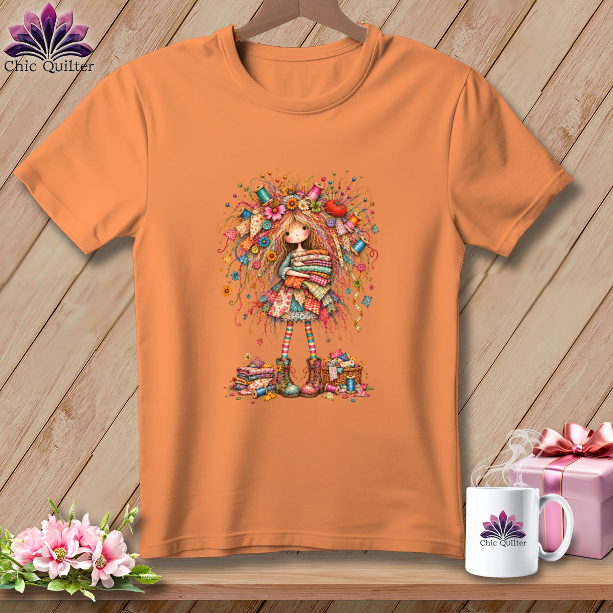 An orange crew neck t-shirt featuring a whimsical illustration of a sewing girl on a wooden background.