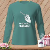 Teal long-sleeve shirt with scissors cutting fabric graphic and text 
