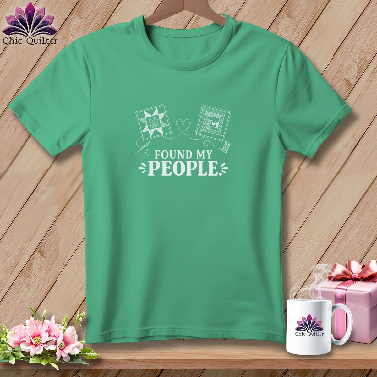 Green t-shirt with quilting designs and the text "FOUND MY PEOPLE".