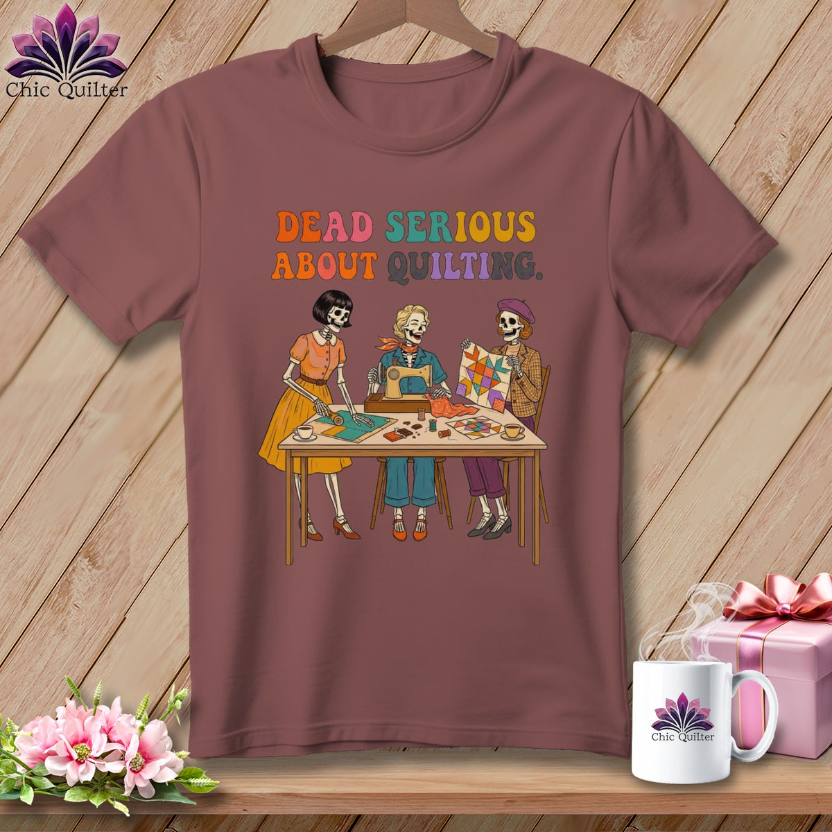 T-shirt with skeletons sewing and quilting, text reads "Dead Serious About Quilting."
