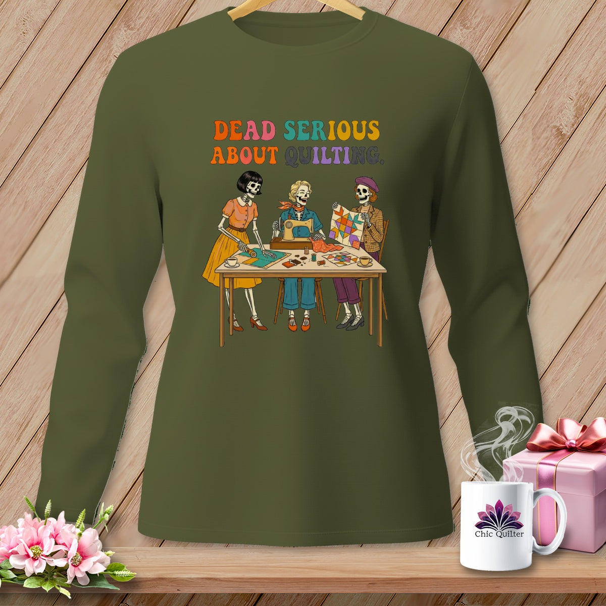 Green long-sleeve shirt with "Dead Serious About Quilting" text and skeleton quilters.