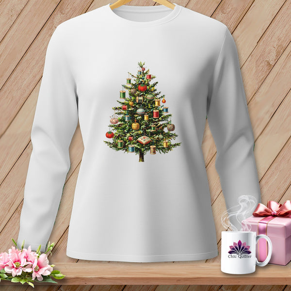 White long-sleeve shirt with a Christmas tree decorated with spools of thread.