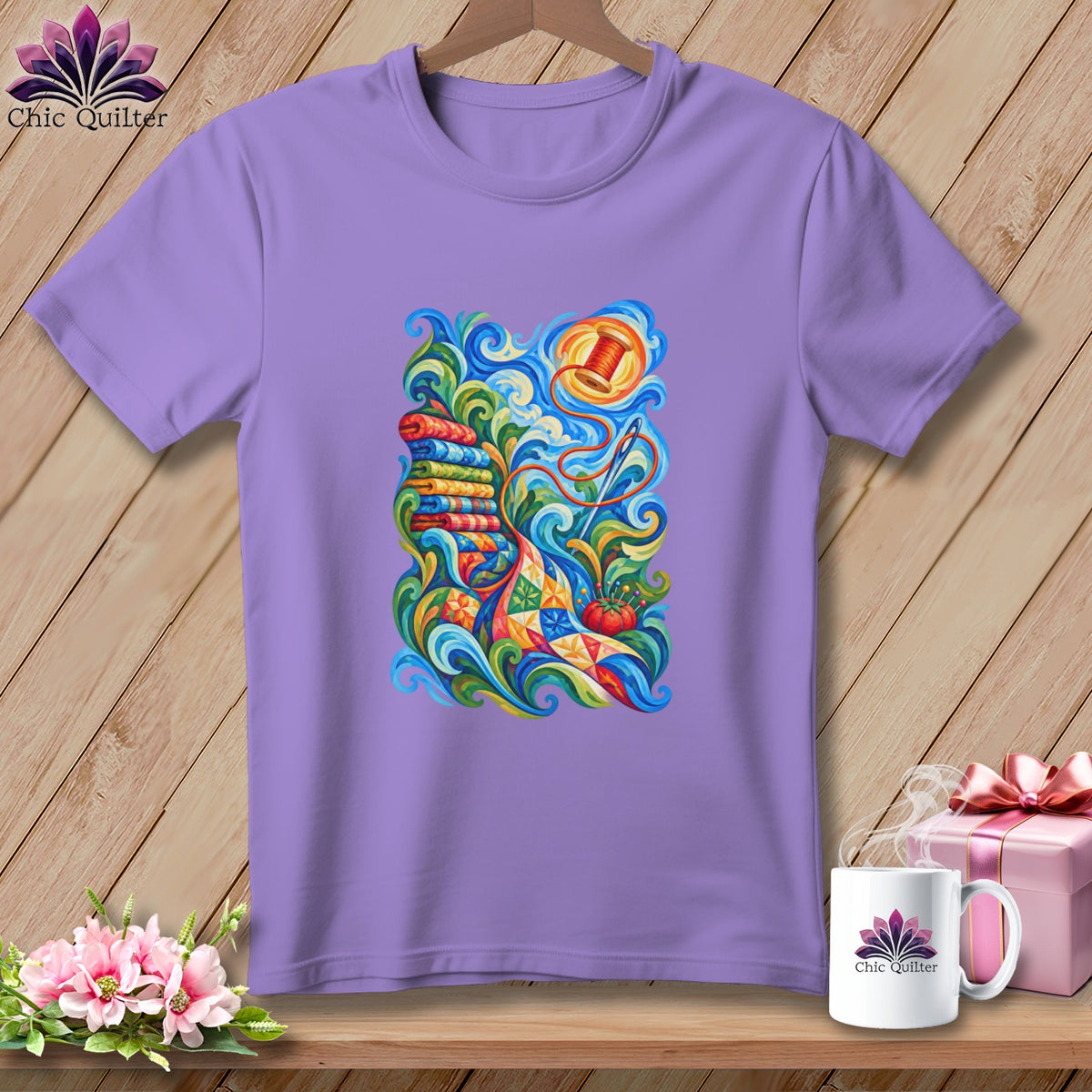 A purple crewneck t-shirt hangs against a wooden wall, featuring a colorful sewing-themed graphic on the front.