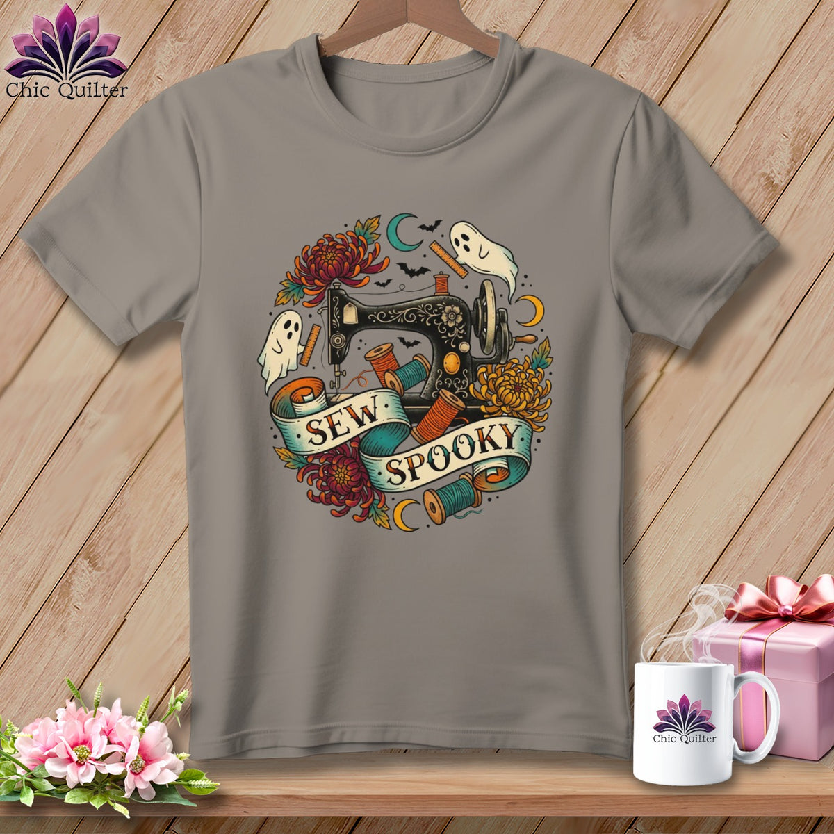 Gray t-shirt with "Sew Spooky" text, sewing machine, ghosts, and flowers.