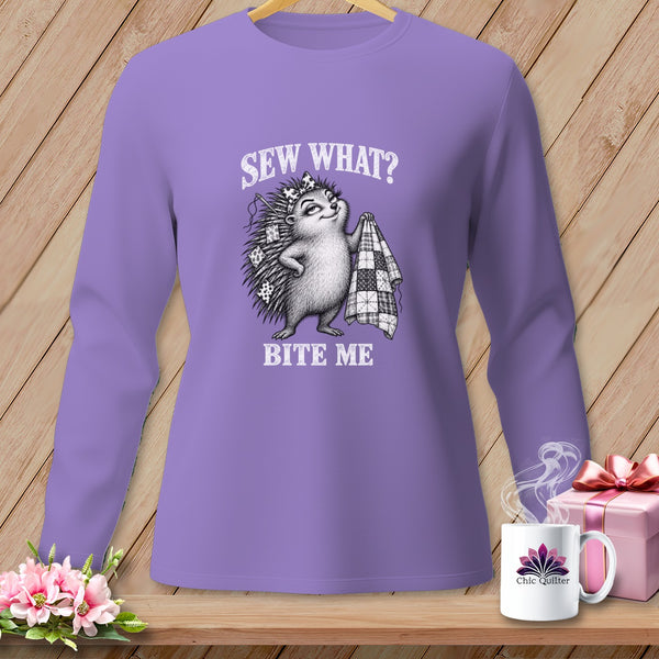 Purple long-sleeve shirt with a graphic of a hedgehog holding a quilt and the text SEW WHAT? BITE ME.
