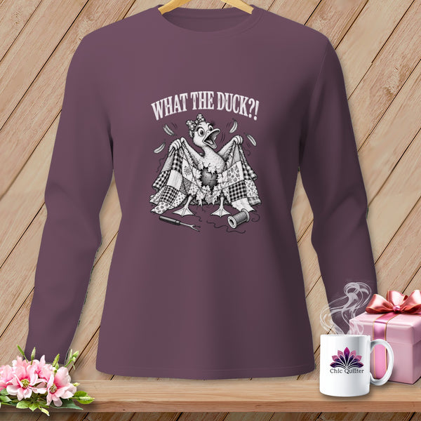 Plum long-sleeve shirt featuring a graphic of a startled duck under a torn quilt with text.