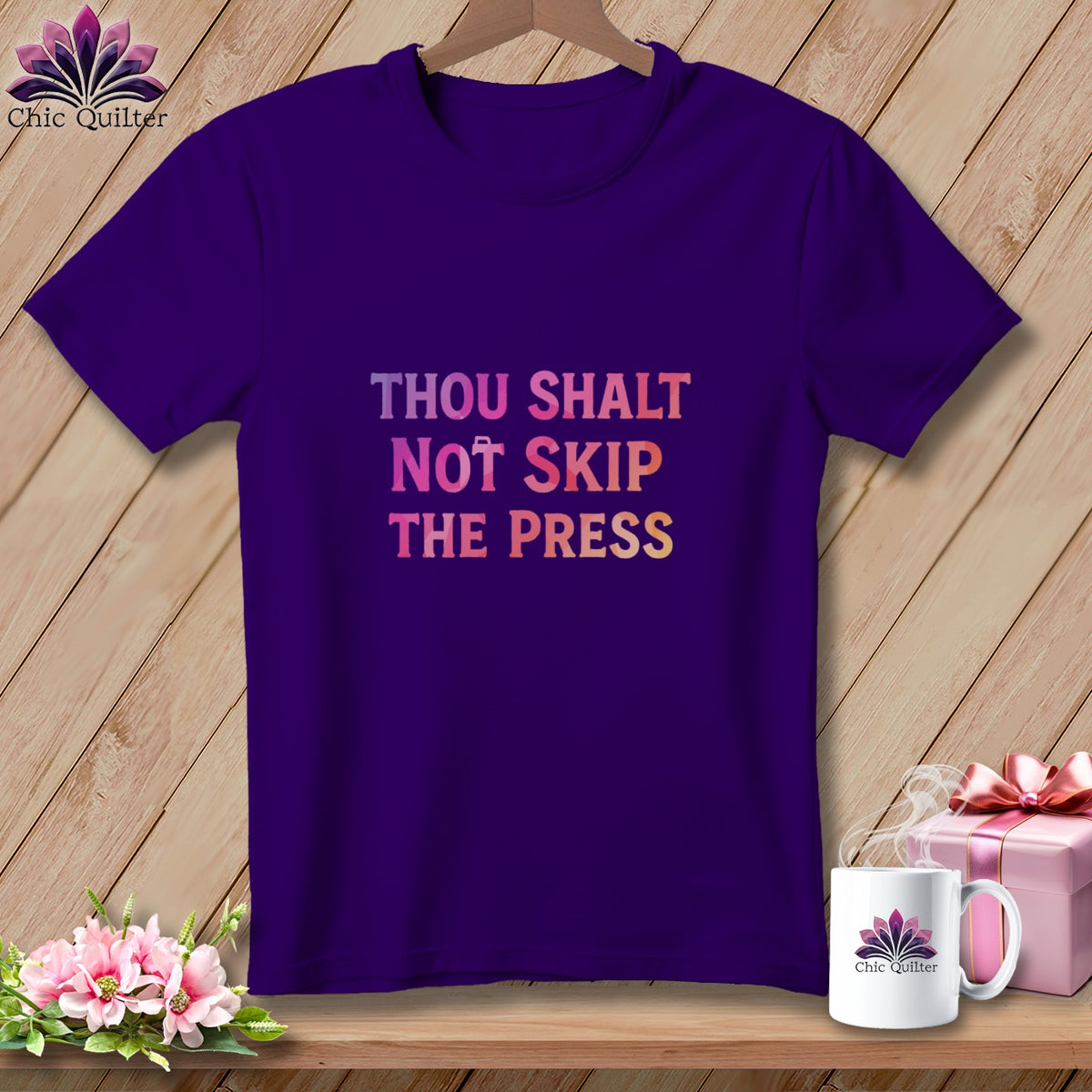 Purple t-shirt with "Thou Shalt Not Skip The Press" text.