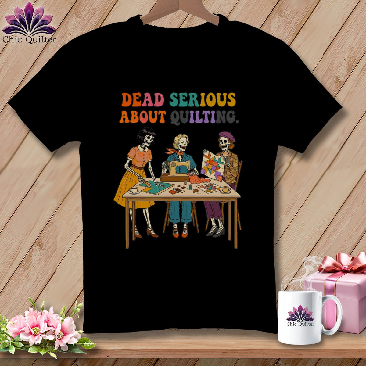 T-shirt graphic with skeletons sewing and quilting, text reads "Dead Serious About Quilting."