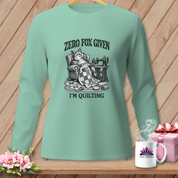 Mint green long-sleeve shirt with "Zero Fox Given I'm Quilting" graphic.