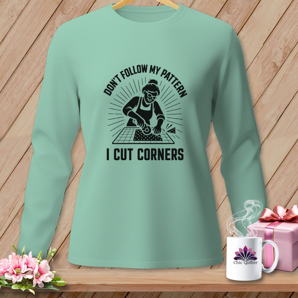Mint long sleeve shirt with graphic "Don't Follow My Pattern, I Cut Corners"