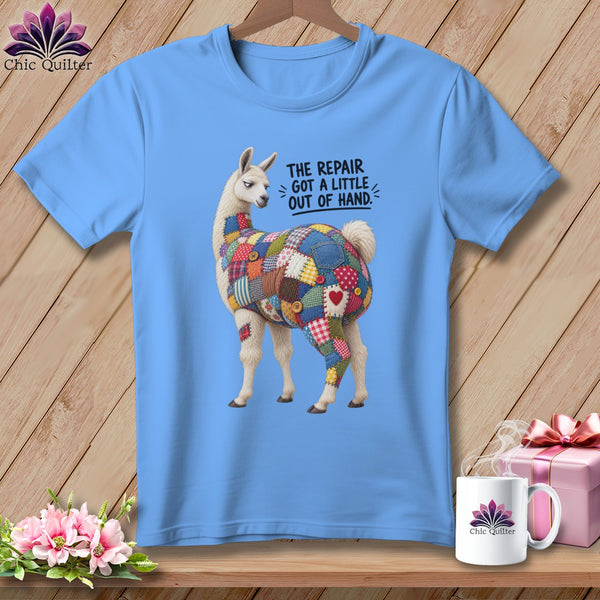 Light blue t-shirt with a llama covered in colorful patchwork fabric and text.