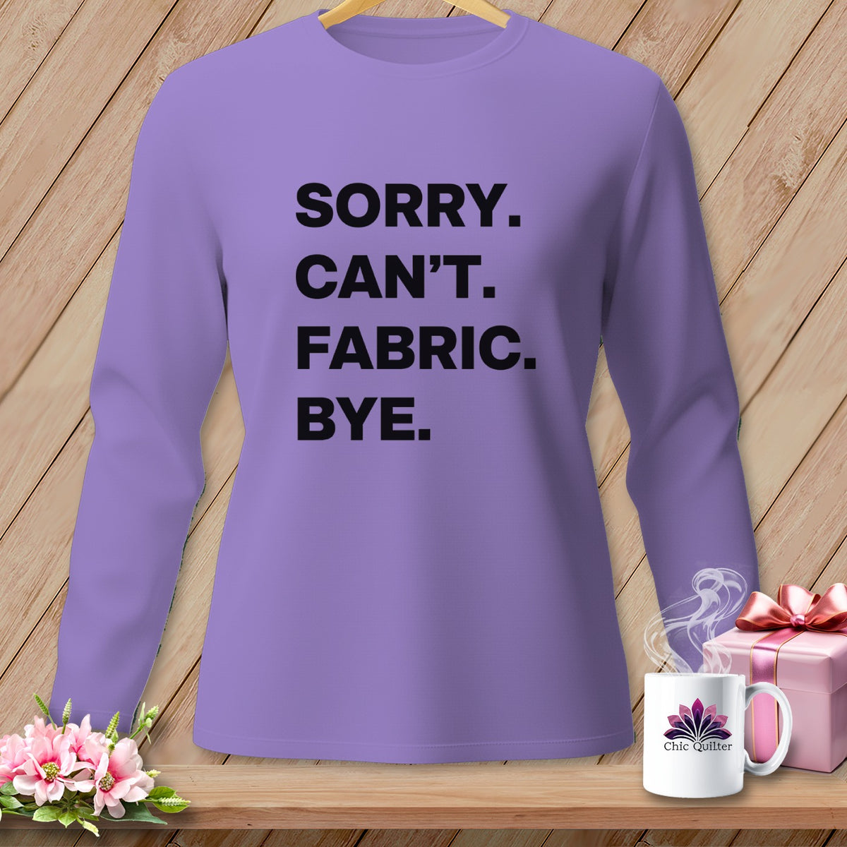 Lavender long sleeve shirt with black text reading "Sorry. Can't. Fabric. Bye."