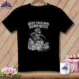 Black t-shirt featuring a vintage illustration of a bear and raccoon with the text Quilt Your Own Damn Quilt.