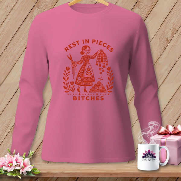 Pink long-sleeve shirt with "Rest in Pieces Bitches" graphic.