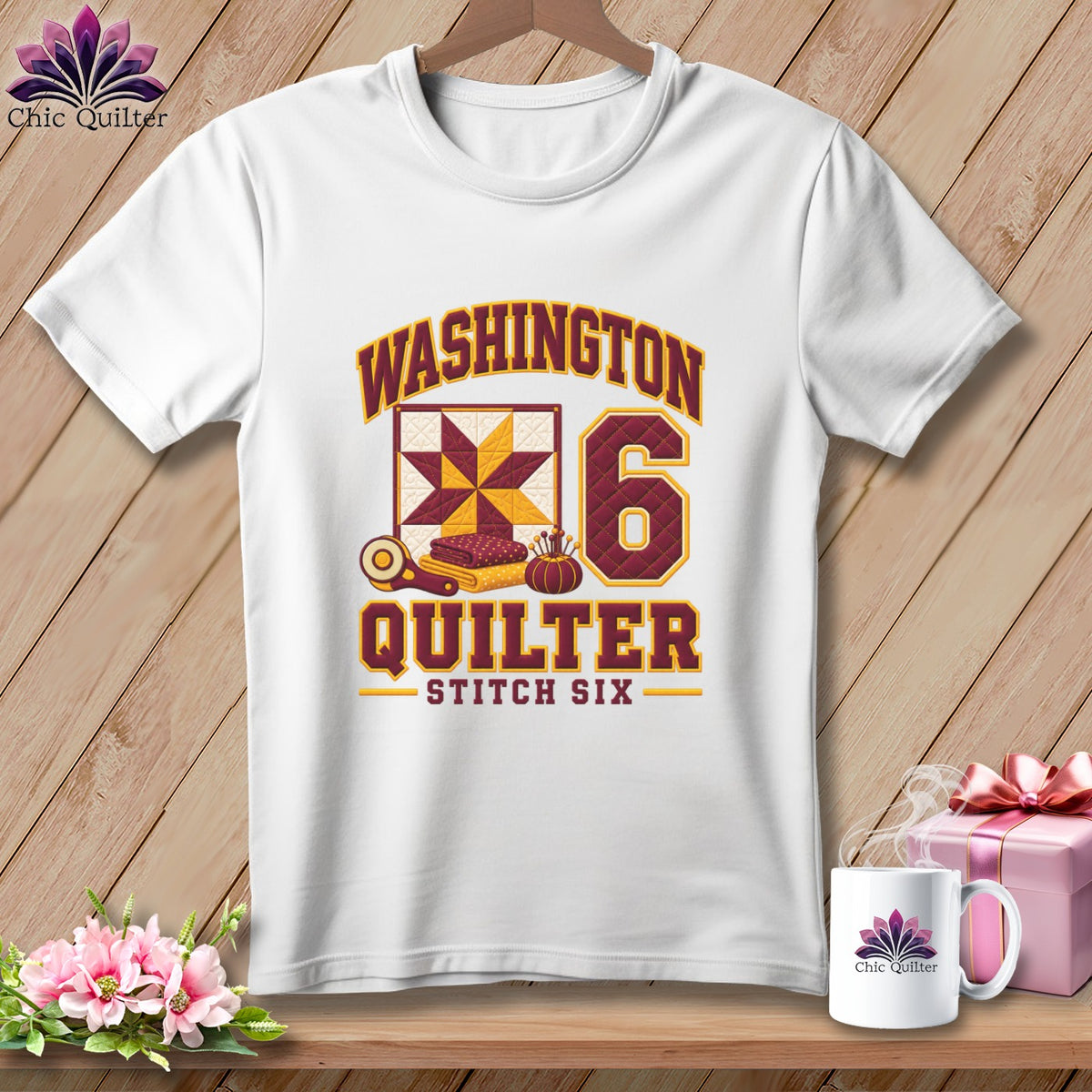 A white t-shirt features a graphic that reads Washington Quilter Stitch Six surrounding a quilt square and the number six.
