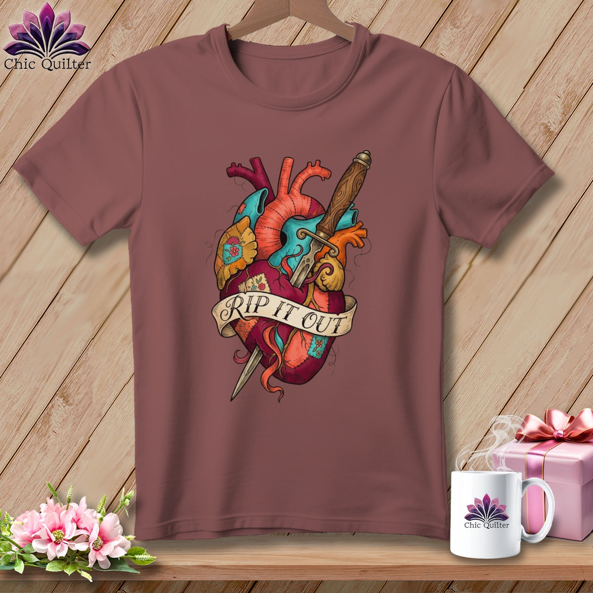 T-shirt with anatomical heart and dagger design that reads "Rip It Out".