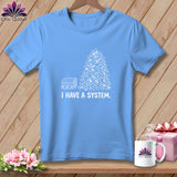 Blue t-shirt with white graphic of a pile of fabric scraps and 