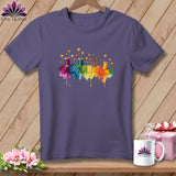 Purple t-shirt with watercolor sewing notions and fabric squares across chest.