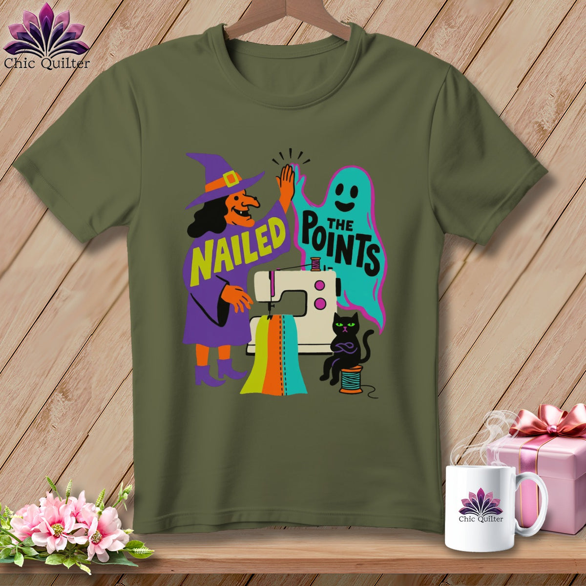 Witch and ghost high-five by sewing machine with text "Nailed The Points".