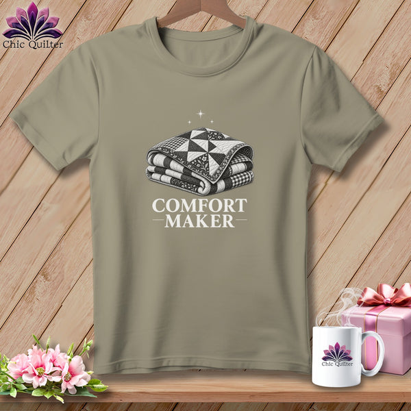 T-shirt with a folded quilt design and "COMFORT MAKER" text.