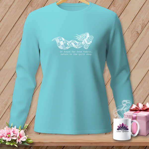 Teal long-sleeve shirt with a mermaid design and text about quilting.