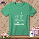 Green t-shirt with white line art of a sewing machine and text 