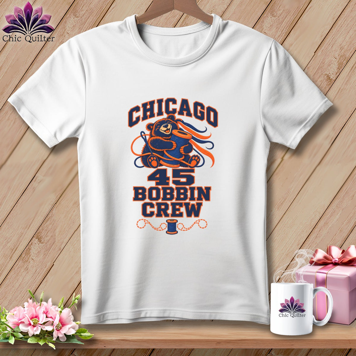 White crewneck t-shirt with a Chicago Bobbin Crew graphic featuring a bear holding a spool.