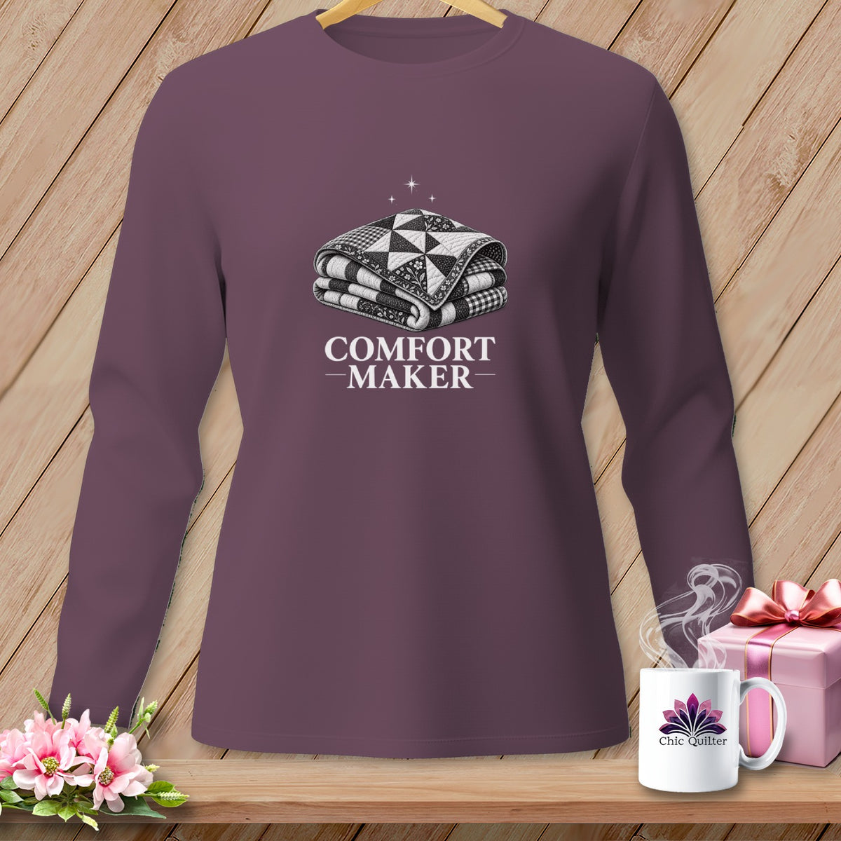 Long sleeve shirt with folded quilt graphic and "COMFORT MAKER" text.