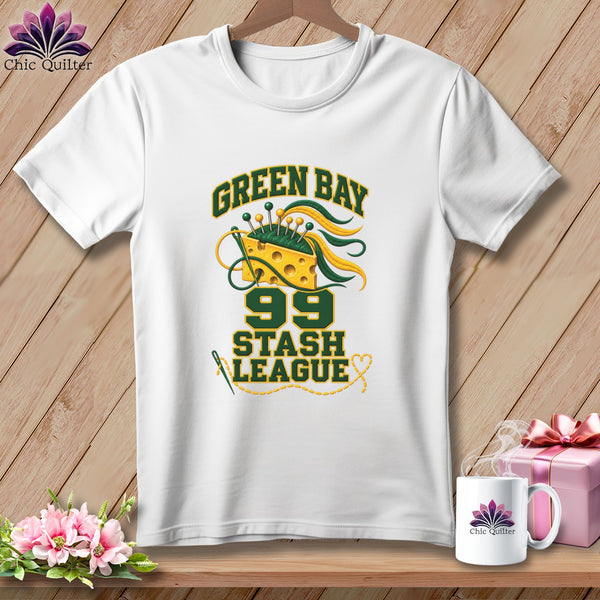 White t-shirt featuring a Green Bay Stash League graphic with cheese wedge, pins, and sewing needle.