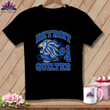 Black t-shirt featuring a blue and white graphic with a lion, spool of thread, and text reading Detroit Quilter.