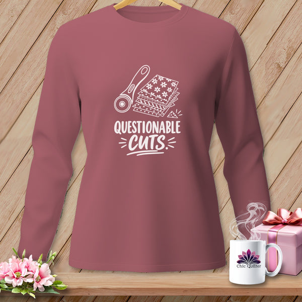 Rose long-sleeve shirt with white graphic of rotary cutter, stacked fabric, and text "QUESTIONABLE CUTS."