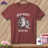 Maroon t-shirt featuring a hedgehog holding a quilt with the text Sew What? Bite Me.