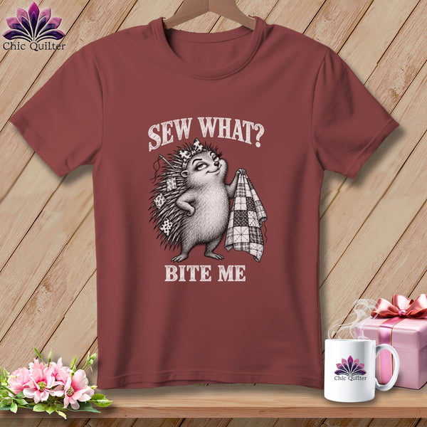 Maroon t-shirt featuring a hedgehog holding a quilt with the text Sew What? Bite Me.