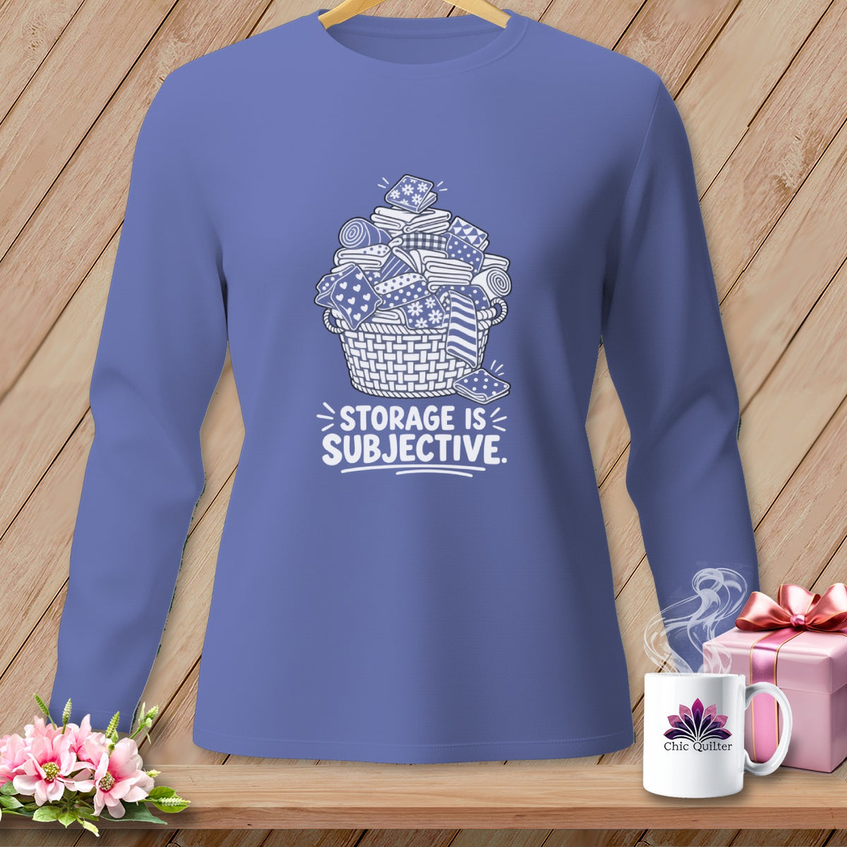Long sleeve shirt with a basket of fabric scraps and the text "STORAGE IS SUBJECTIVE."