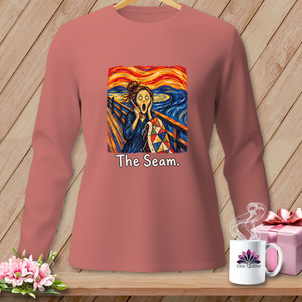 Long sleeve shirt with "The Seam" text and a screaming figure holding a quilt.