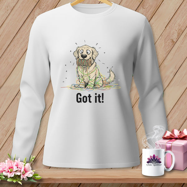White long-sleeved shirt with cartoon dog entangled in yarn, saying "Got it!"