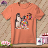 Orange t-shirt with two penguins and text 
