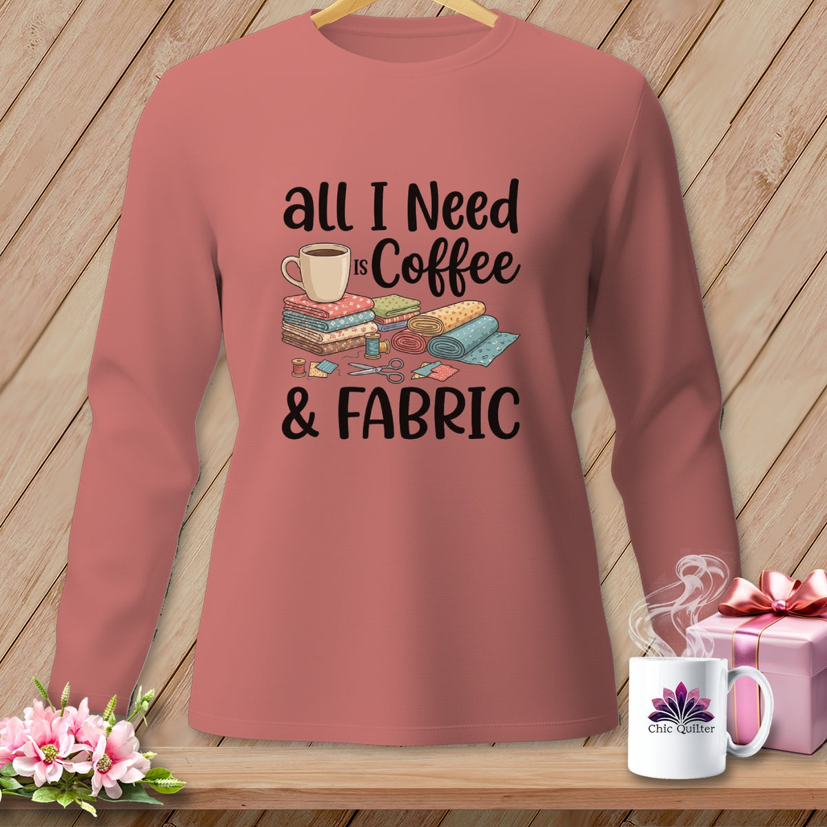 Long-sleeve shirt with "All I Need is Coffee & Fabric" graphic and sewing notions.