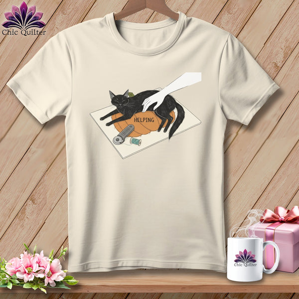 Cream t-shirt graphic: black cat on pumpkin with sewing notions and text "HELPING".