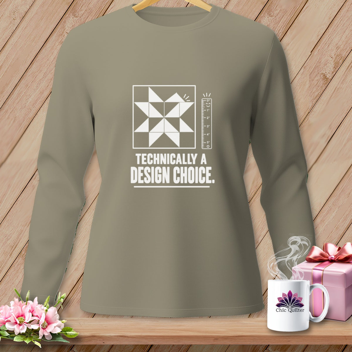 Long-sleeve shirt with a quilting block design and "Technically a Design Choice" text.