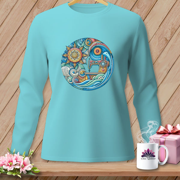 Aqua long-sleeve shirt with circular sewing machine and sun mandala design.