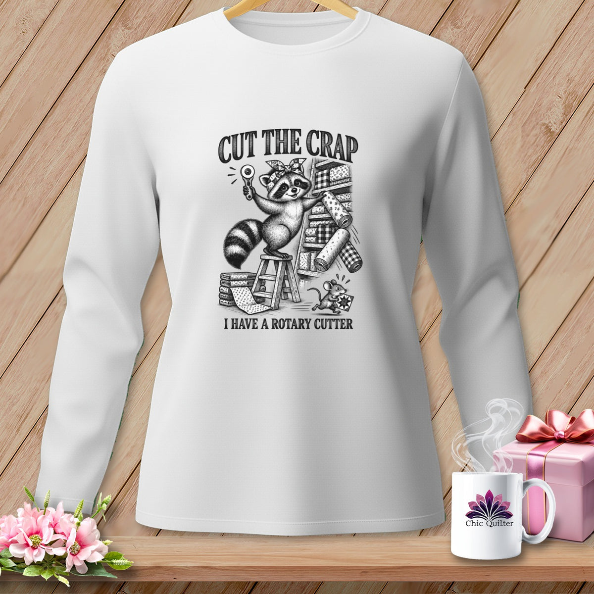 White long sleeve shirt with raccoon graphic and text "CUT THE CRAP I HAVE A ROTARY CUTTER".