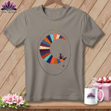 Gray t-shirt featuring a patchwork crescent moon with a witch riding it.
