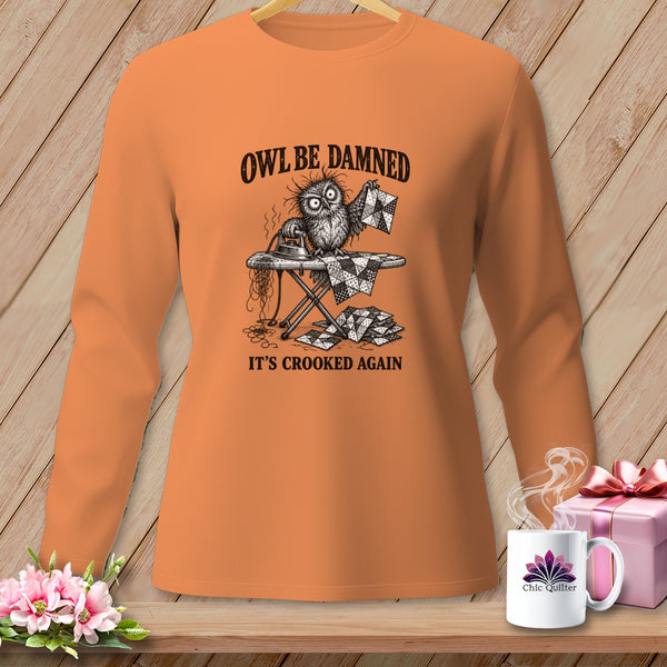 T-shirt with a graphic of a frustrated owl ironing a crooked quilt, reading "Owl be damned, it's crooked again."