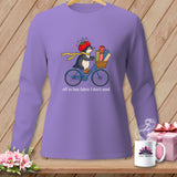 Penguin on a bicycle with fabric rolls, wearing a tomato pincushion hat, text 