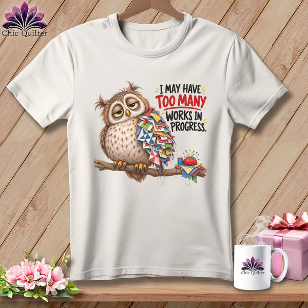 T-shirt with a sleepy owl, patchwork fabric, and text "I MAY HAVE TOO MANY WORKS IN PROGRESS".
