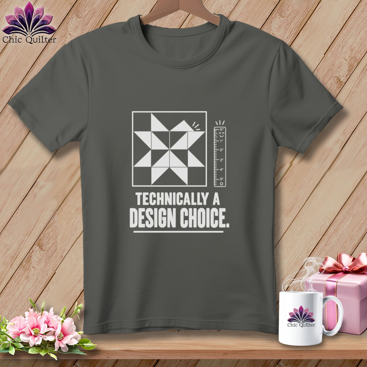 Dark gray t-shirt with white quilting block, ruler, and "Technically a Design Choice" text.