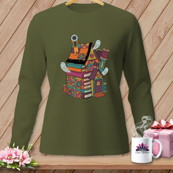 Quilting-themed house made of books, fabric, and notions with ghost embellishments.