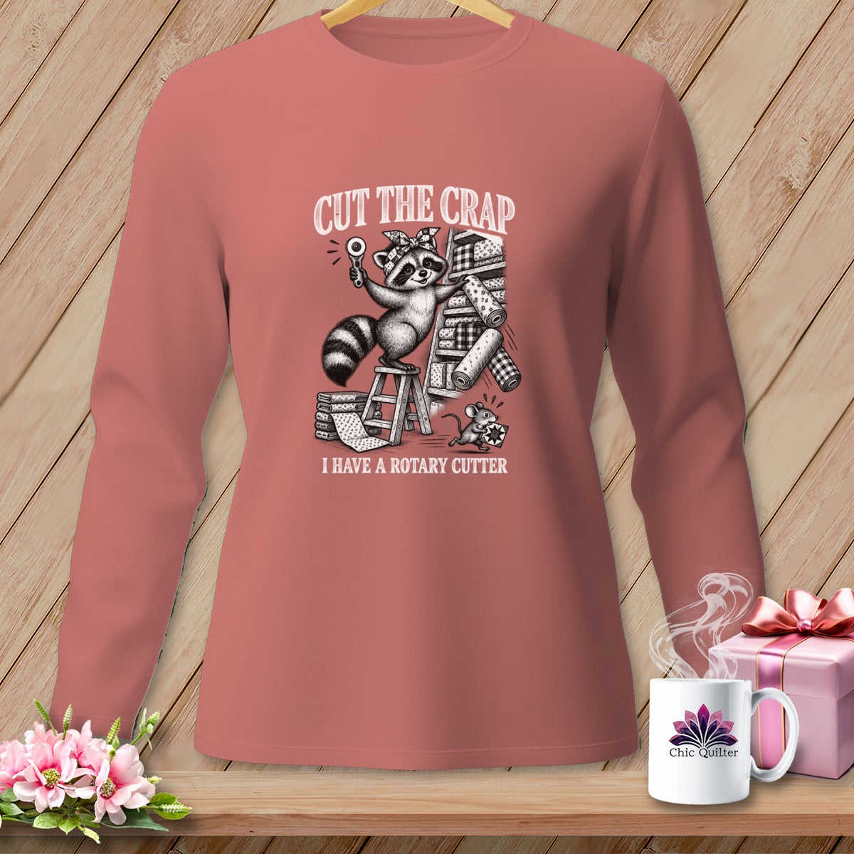 Raccoon holding rotary cutter and fabric with text "CUT THE CRAP I HAVE A ROTARY CUTTER".