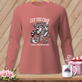 Raccoon holding rotary cutter and fabric with text 